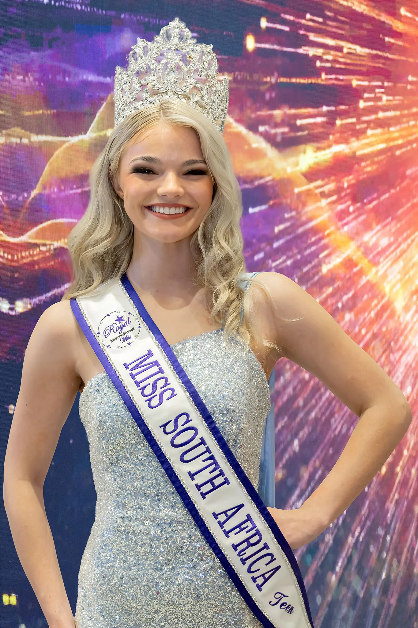 Lana du Toit crowned Teen, in a silver sequinned gown with her crown and sash
