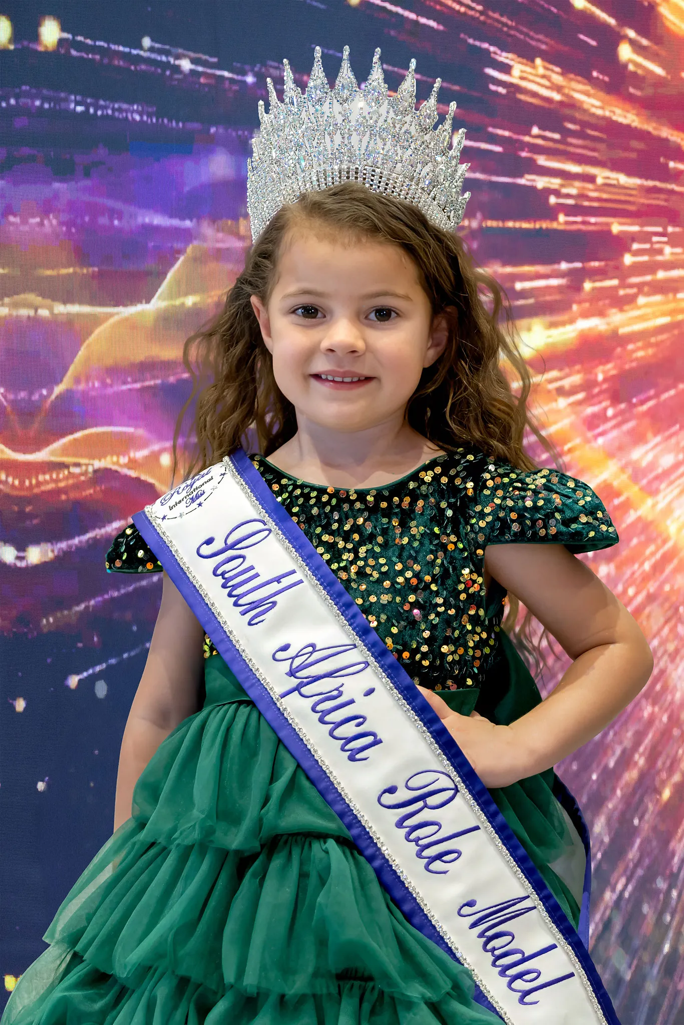 Laruché Venter crowned Princess Role Model, in an emerald sequinned dress with a tulle skirt