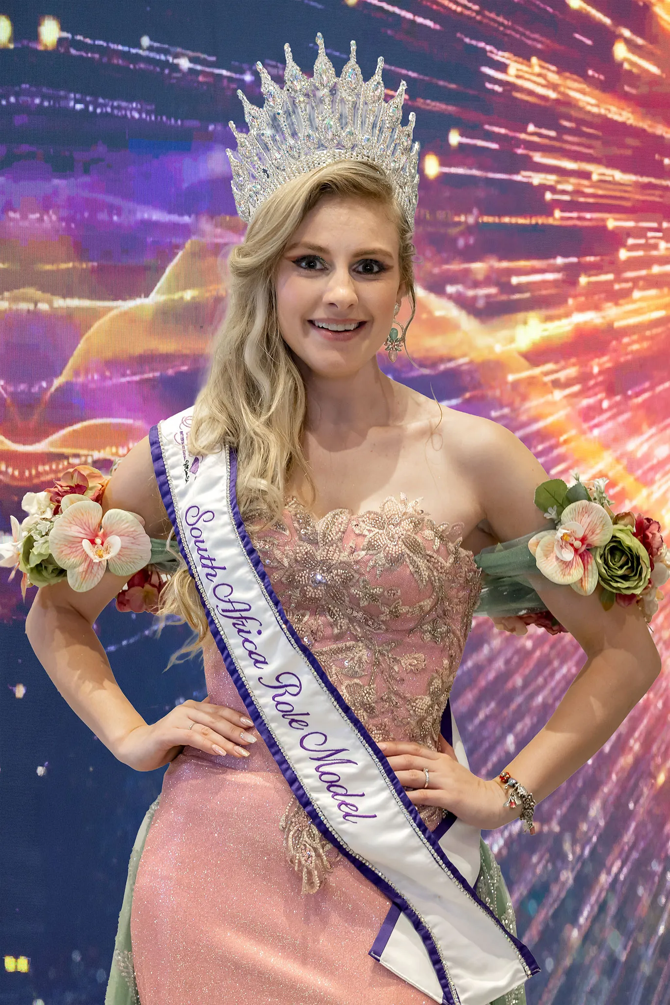Lehandra Mienie crowned Role Model Ms, in a blush embellished gown with flowers at her shoulders