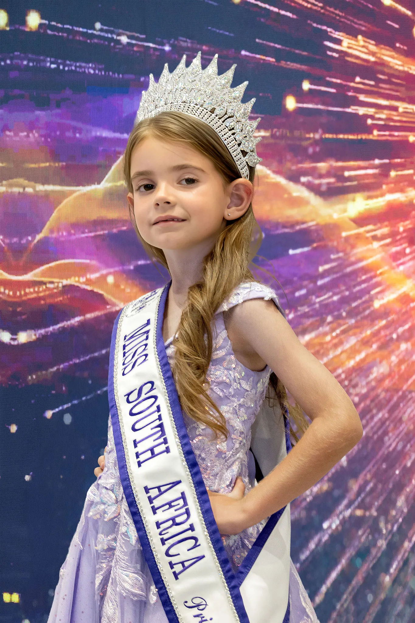 Mignon Scott crowned Princess, in a lilac lace dress with her crown and sash