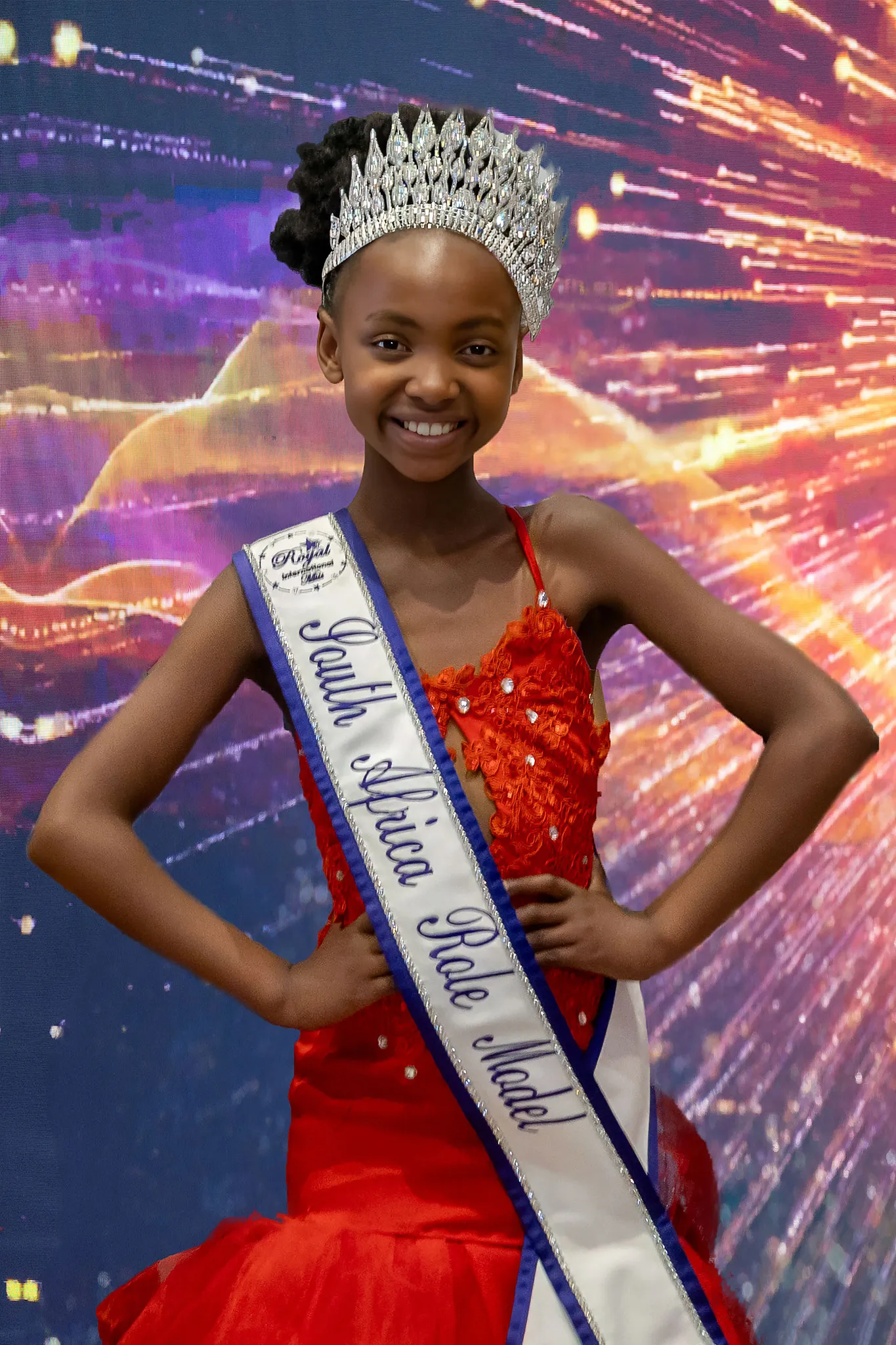 Onthatile Letsoisa crowned Sweetheart Role Model, in a red sequinned dress with her crown and sash