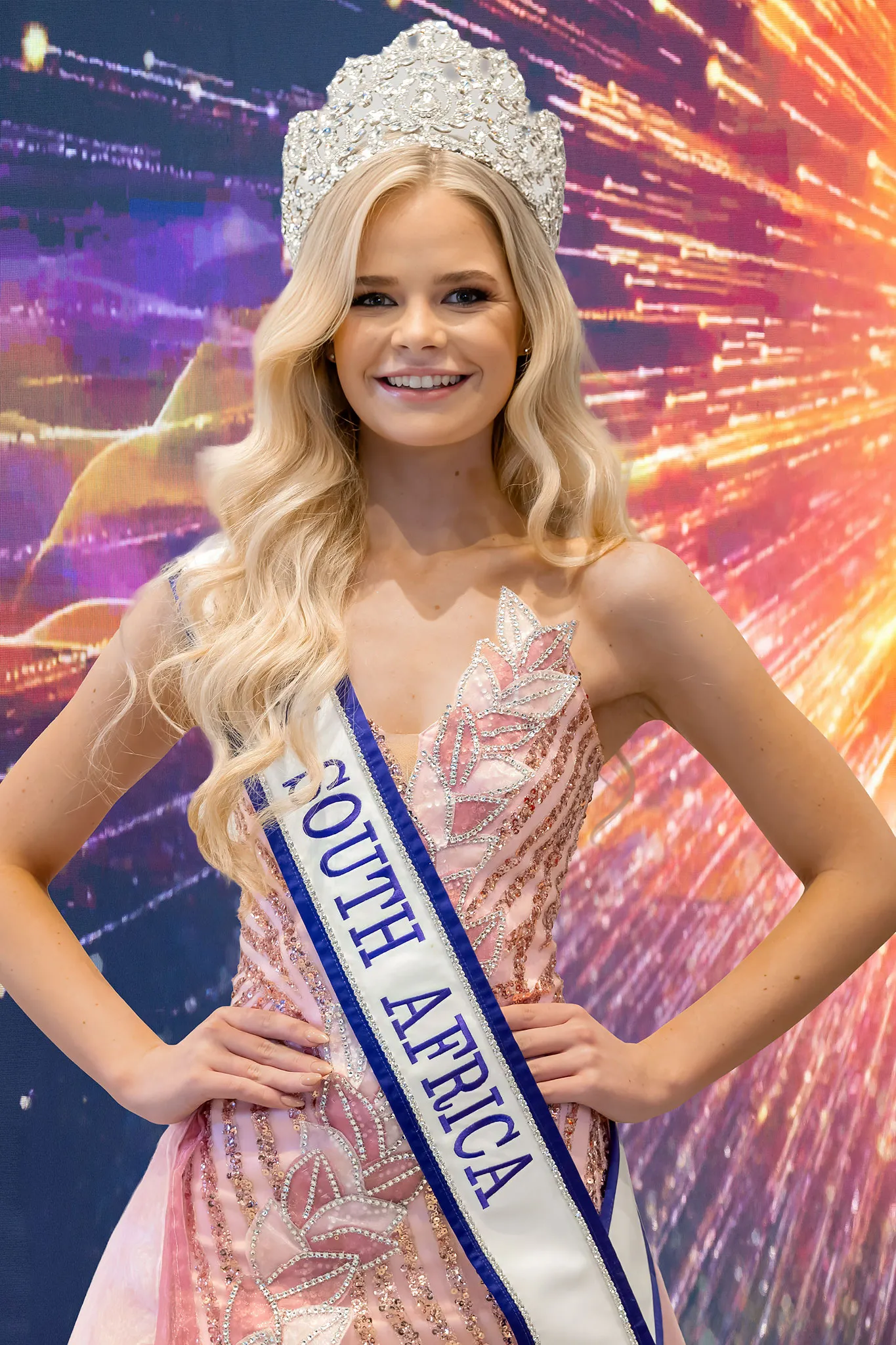 Zané van der Merwe crowned Miss, in a blush-pink beaded gown with her crown and sash